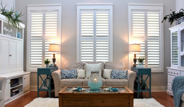Southern California designer sunroom with white shutters 